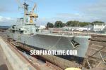 ID 100 HMNZS WELLINGTON (F69, ex-HMS BACCHANTE), now decommissioned, seen in the VT Fitroy drydock in Auckland being prepared for towing south to Wellington where she will be sunk off the coast to become a...